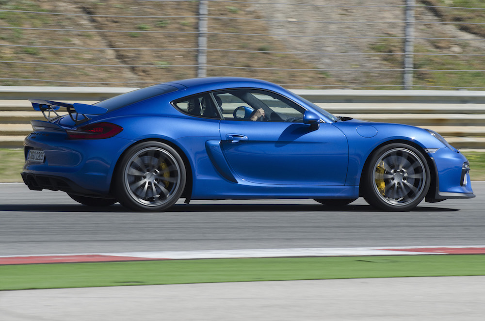 Blue Porsche Cayman GT4 on track